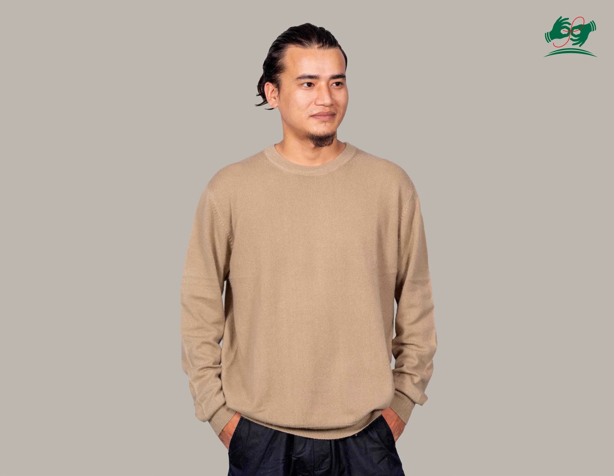 Men's crew neck cashmere sweater in Sandstone, showing the knitted surface and rib